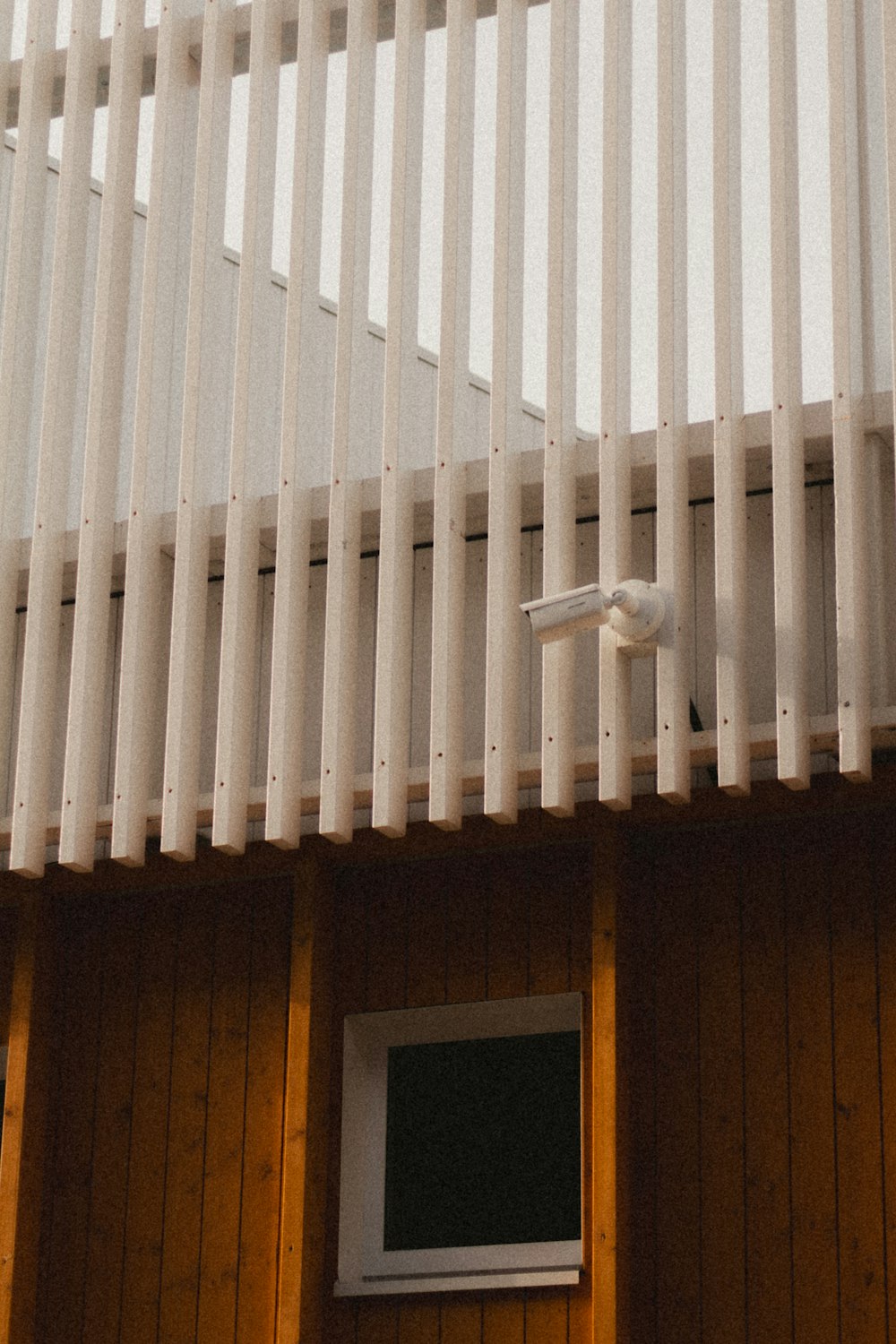 a security camera mounted on the side of a building