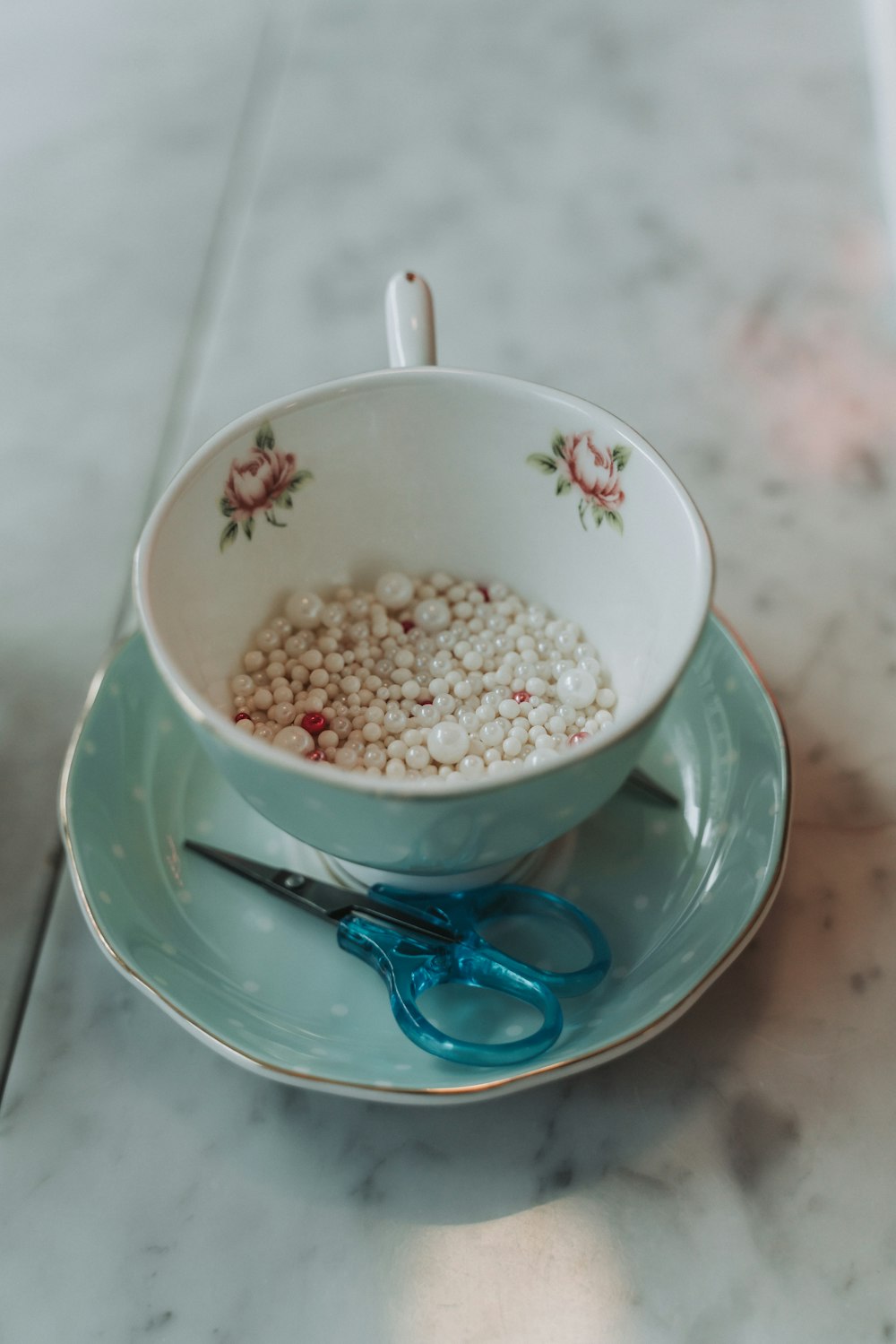 a bowl of cereal and a pair of scissors on a plate