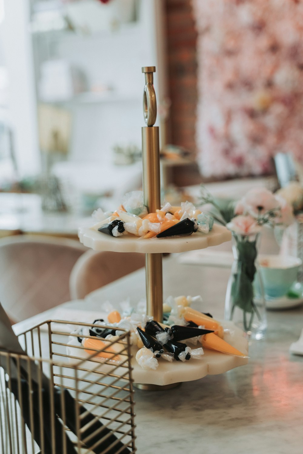 a three tiered cake stand on a table