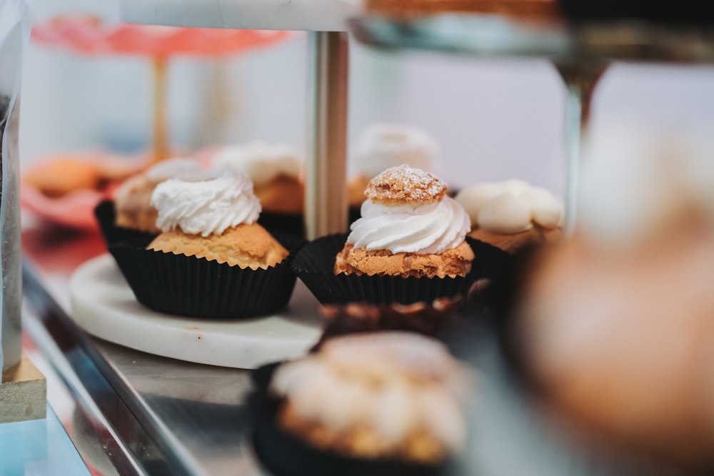 a close up of a plate of cupcakes