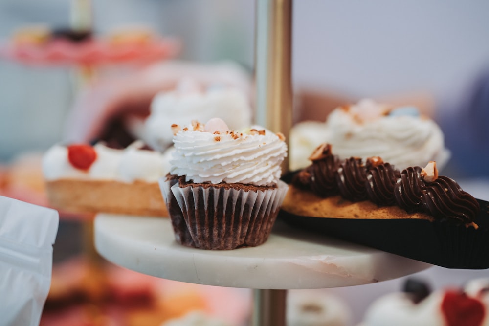 a close up of a plate of cupcakes