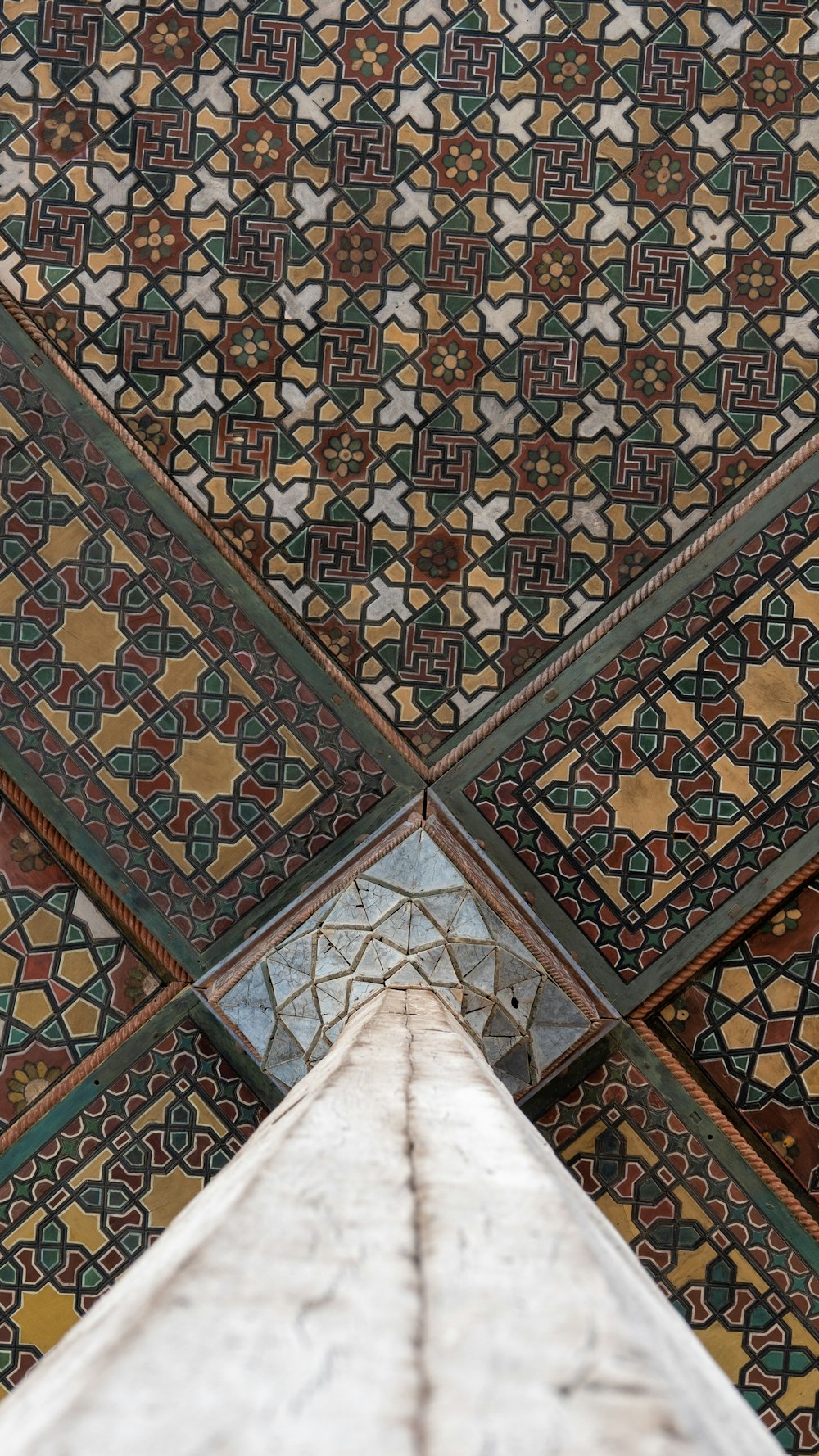a close up view of a tiled ceiling