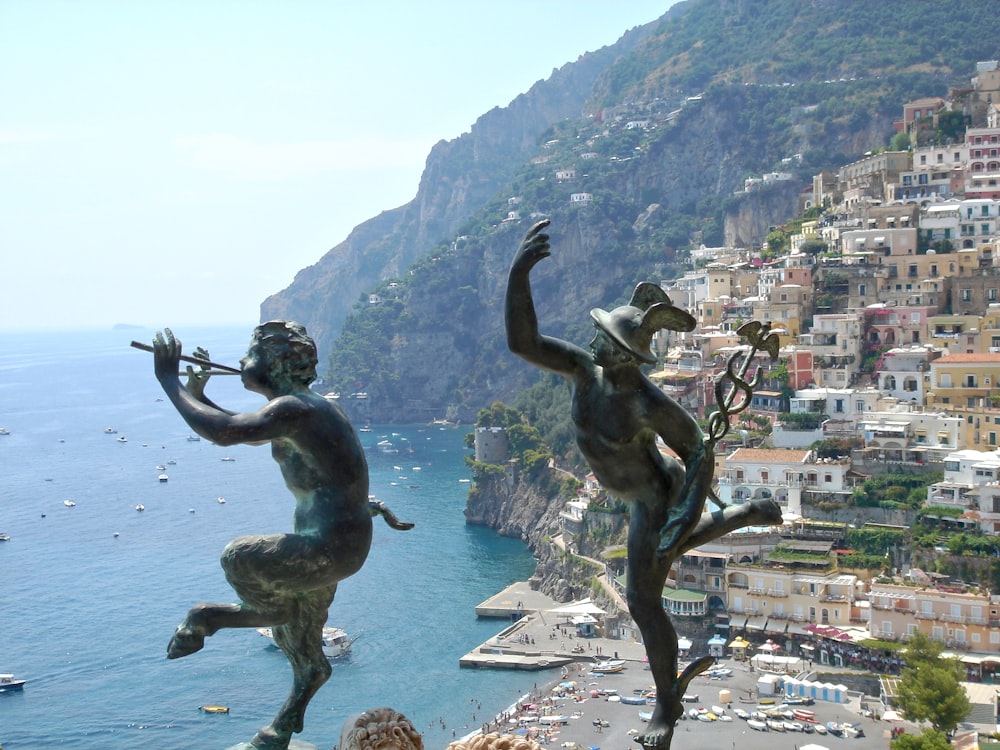 a statue of a man and a woman playing the flute