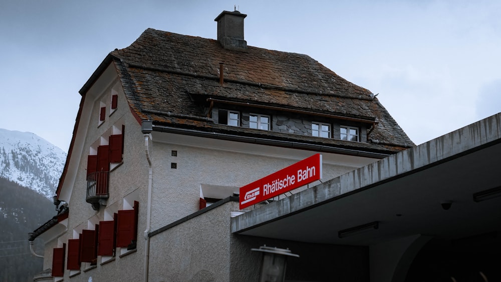 a red sign that is on the side of a building