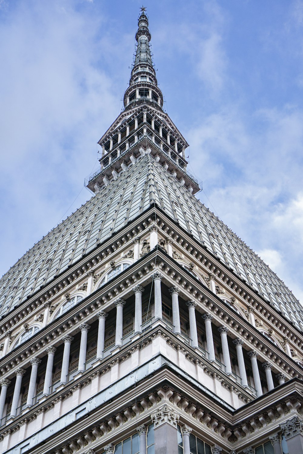 a very tall building with a clock on it's side