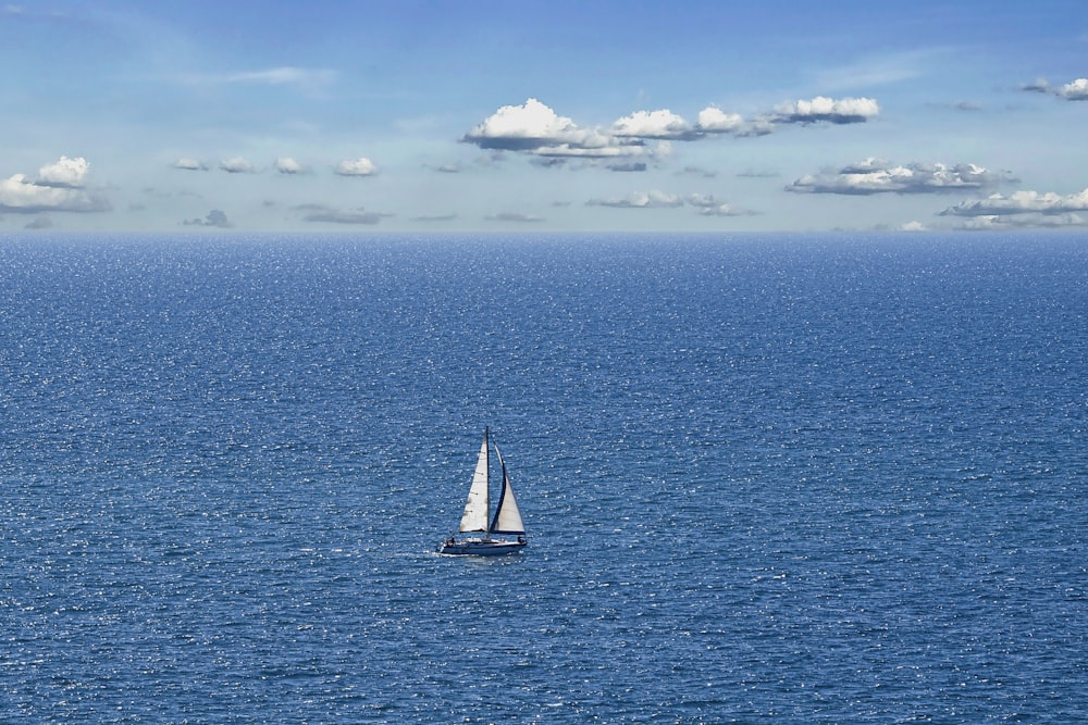 a sailboat in the middle of a large body of water