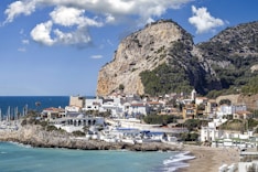 a view of a beach with a mountain in the background