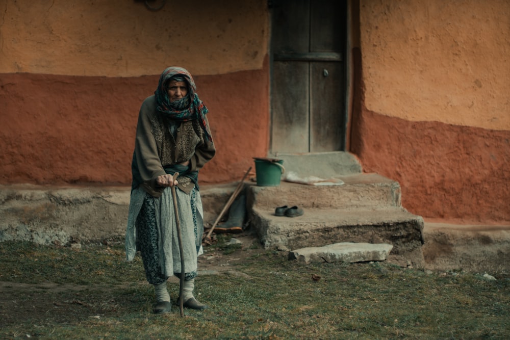 a woman standing in front of a building