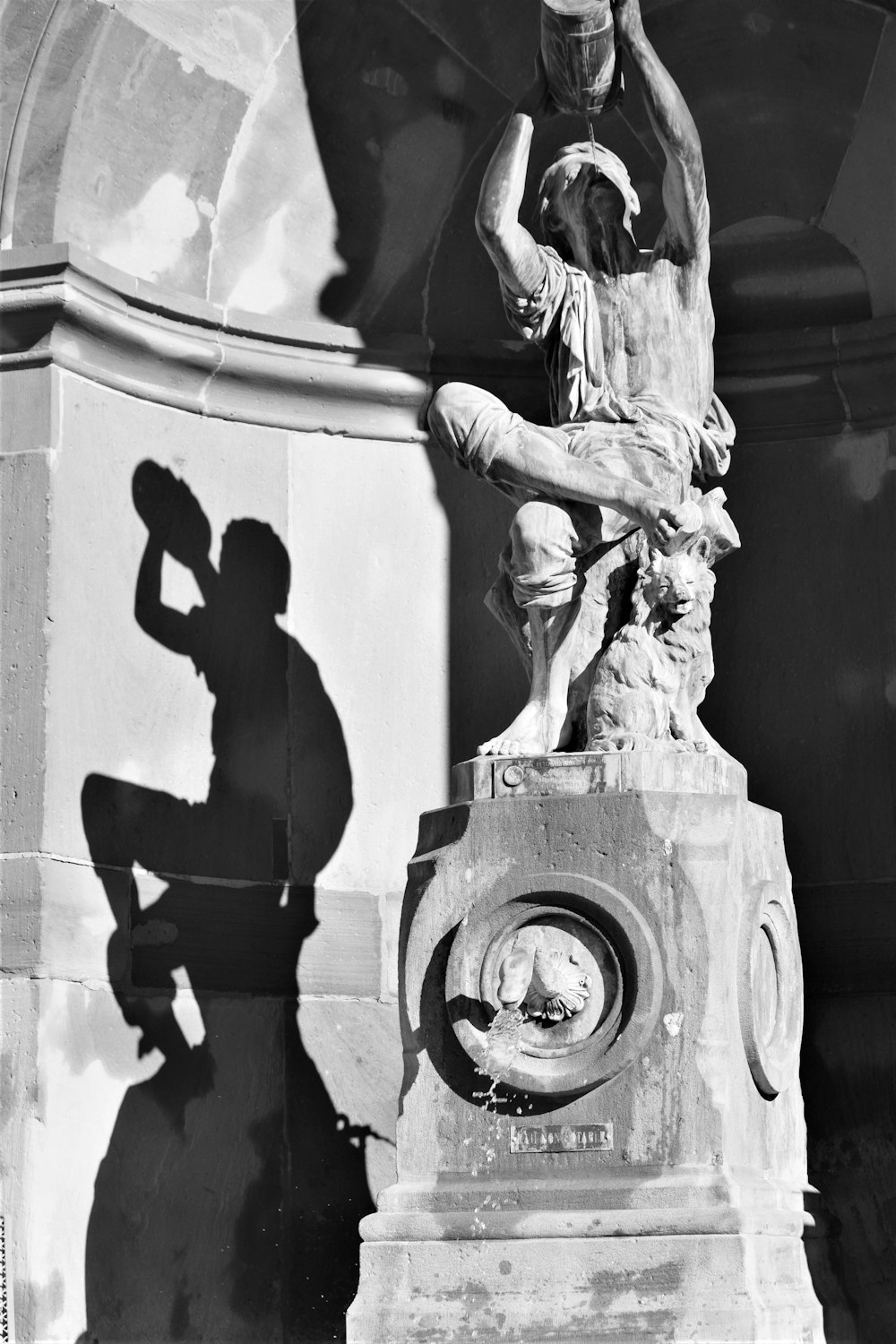 a black and white photo of a statue