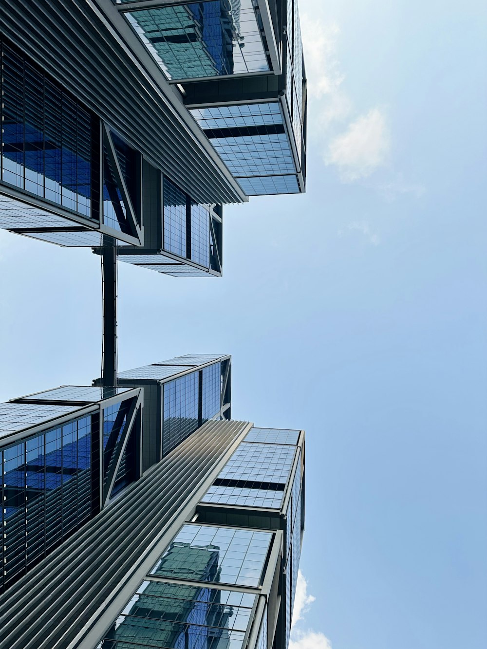 a group of tall buildings with windows and balconies