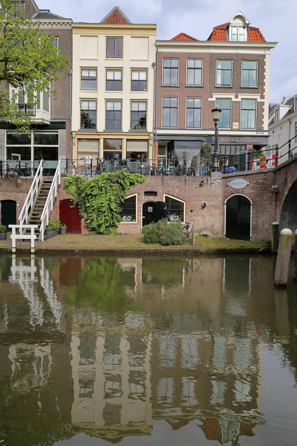 a body of water with buildings in the background