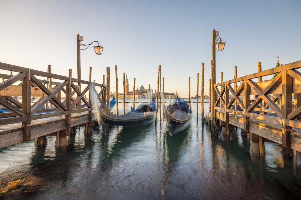 a couple of boats that are sitting in the water