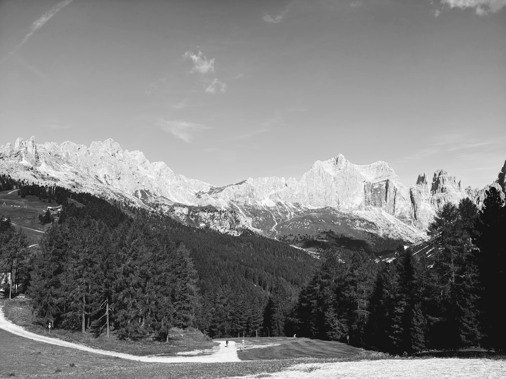 a black and white photo of a mountain range