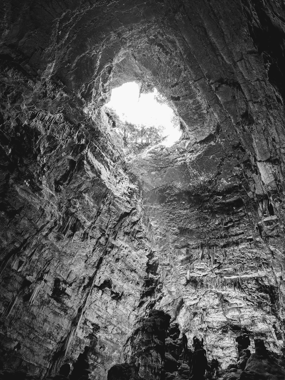 a black and white photo of a cave