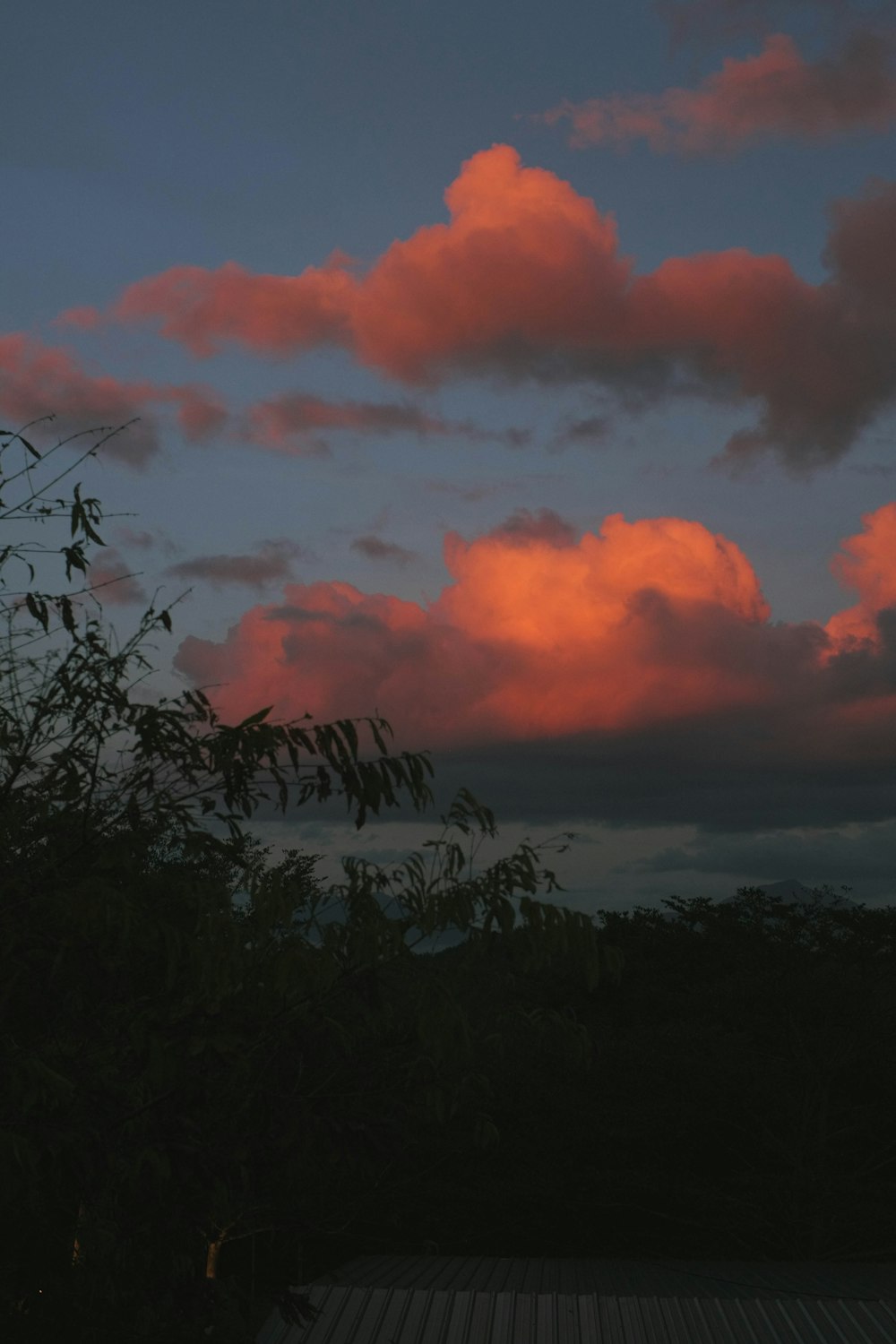 a red sky with some clouds in the background