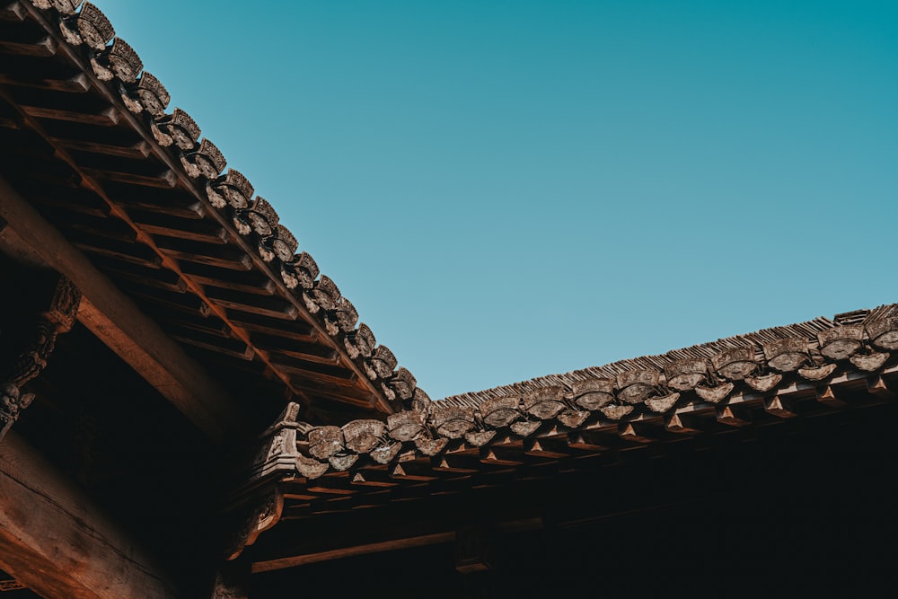 the roof of a building with a blue sky in the background