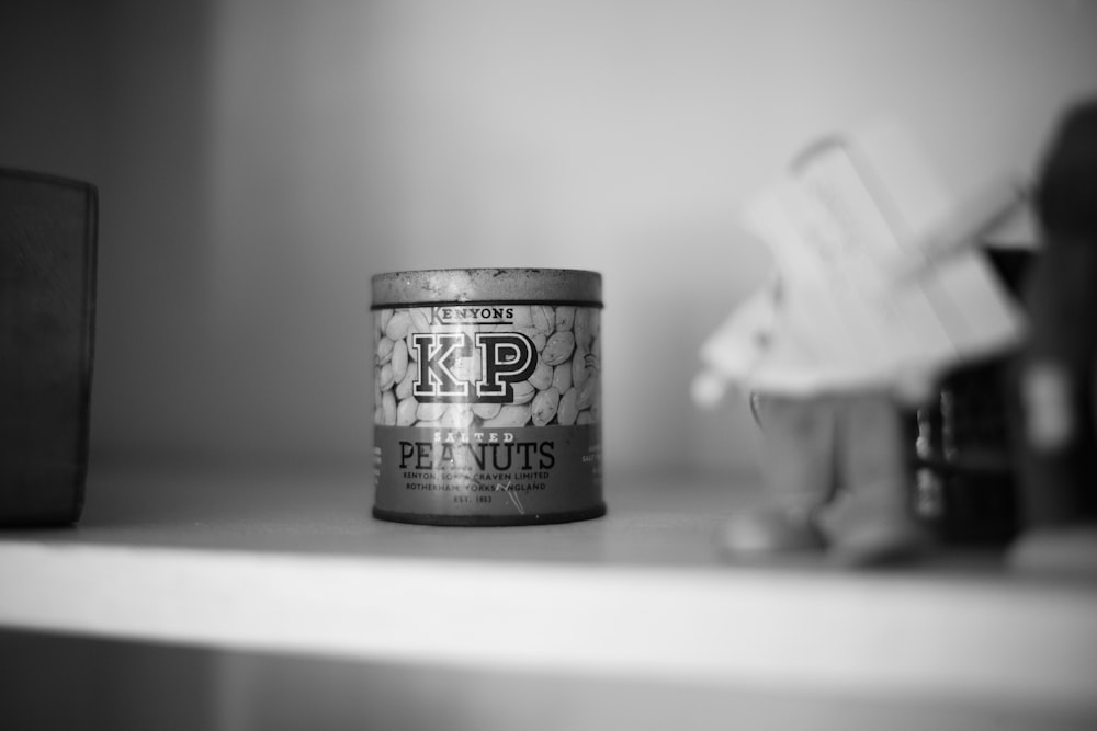 a can of kpi nuts sitting on a shelf