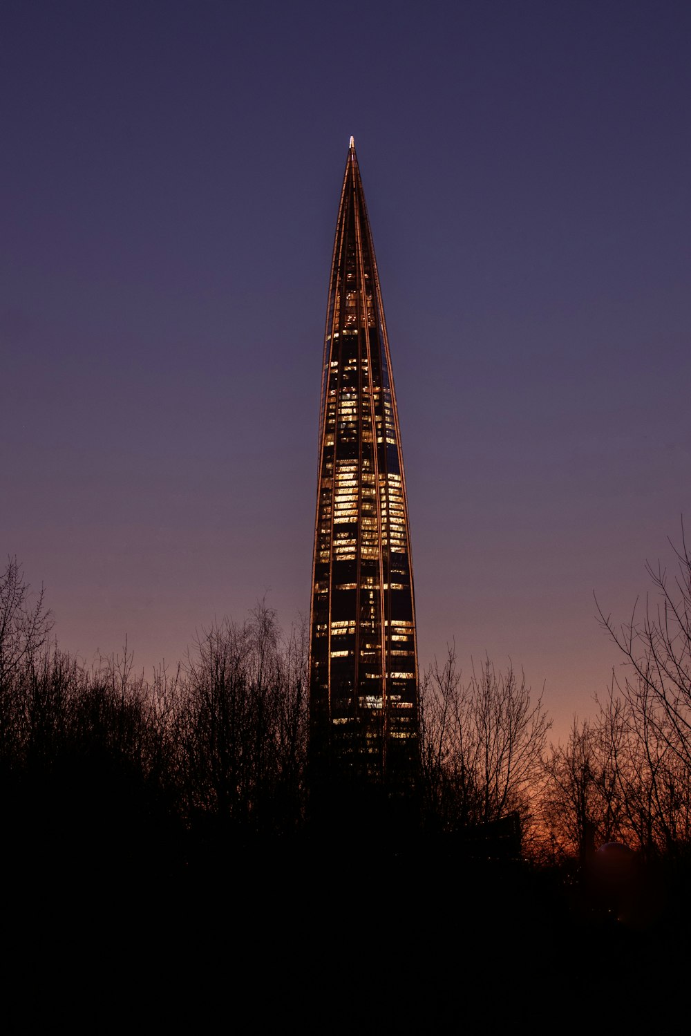 a very tall building with a clock on it's side