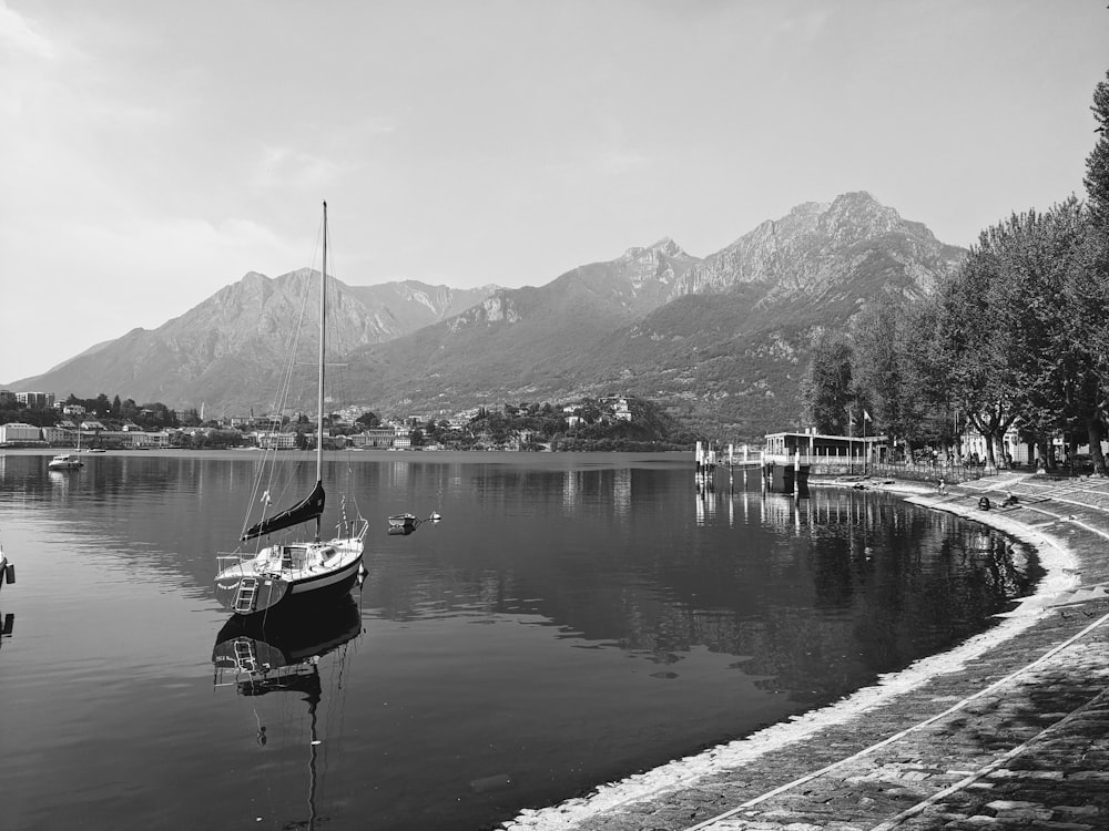 a black and white photo of a boat in the water