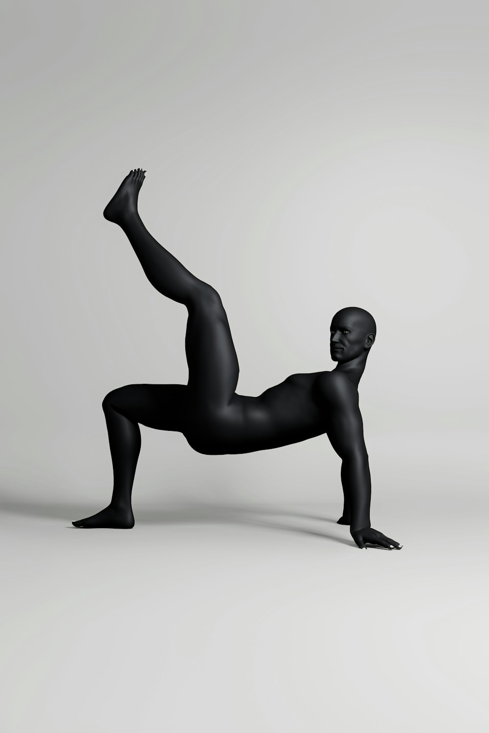 a person in a black body suit doing a yoga pose