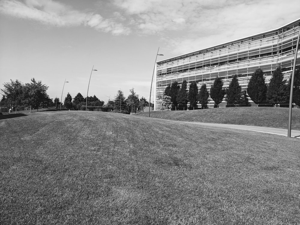 a black and white photo of a building on a hill