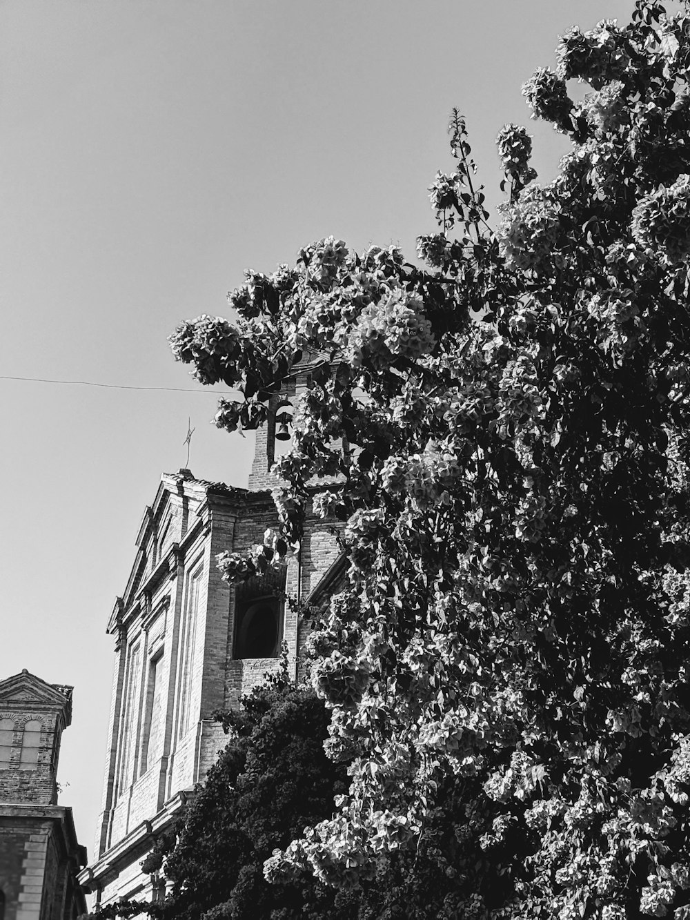 a black and white photo of a clock tower