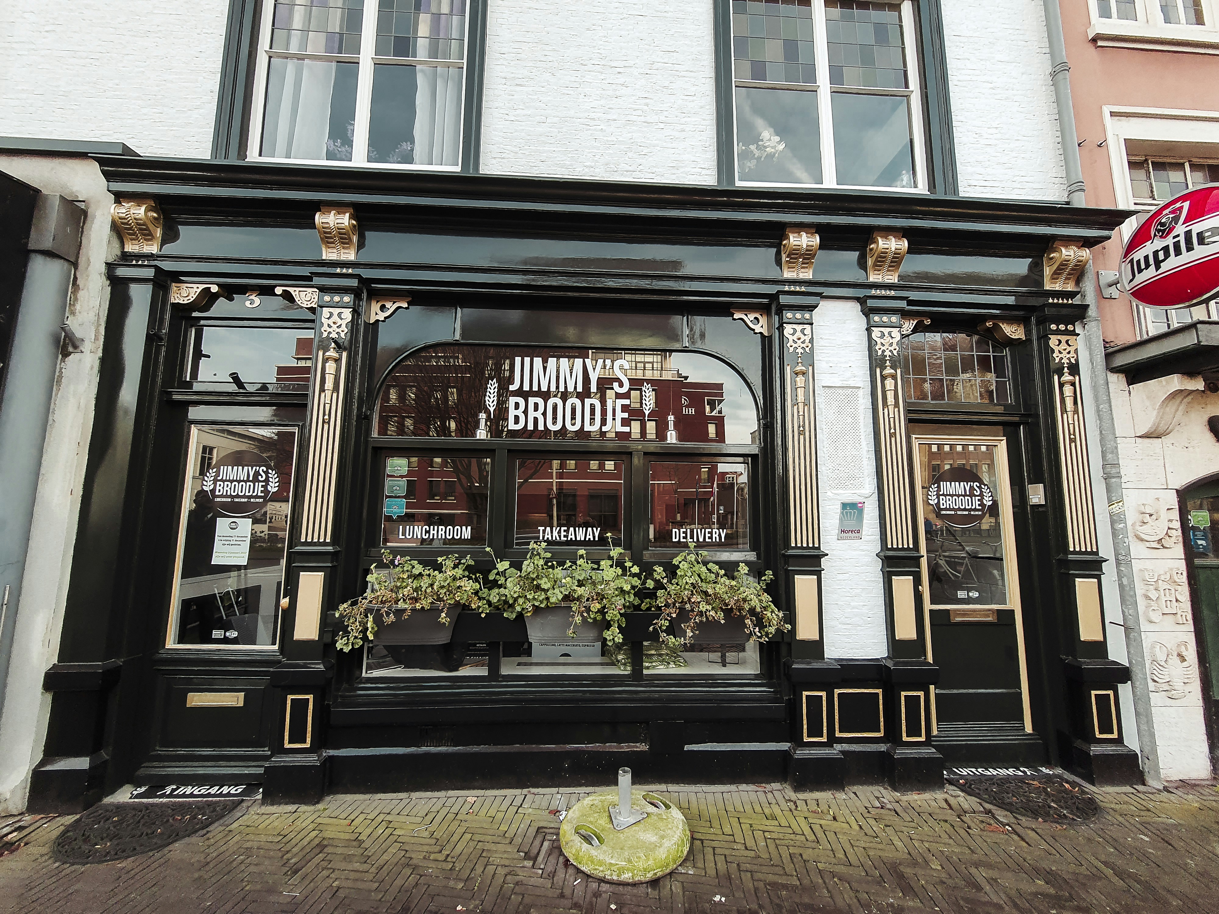 a store front with a planter in the window