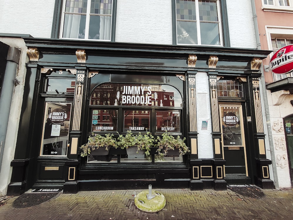 a store front with a planter in the window