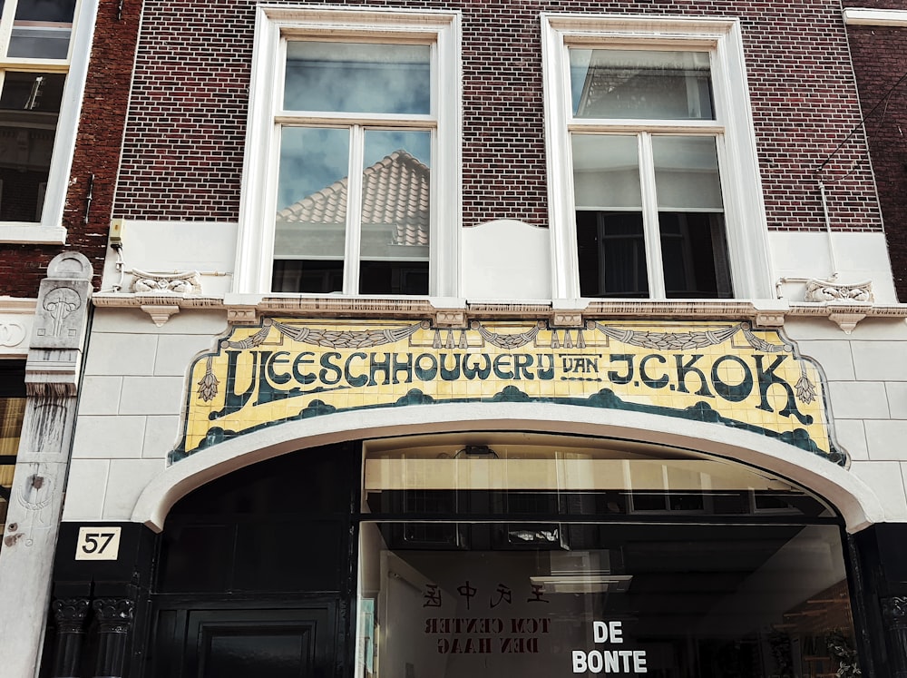 a store front with a clock on the front