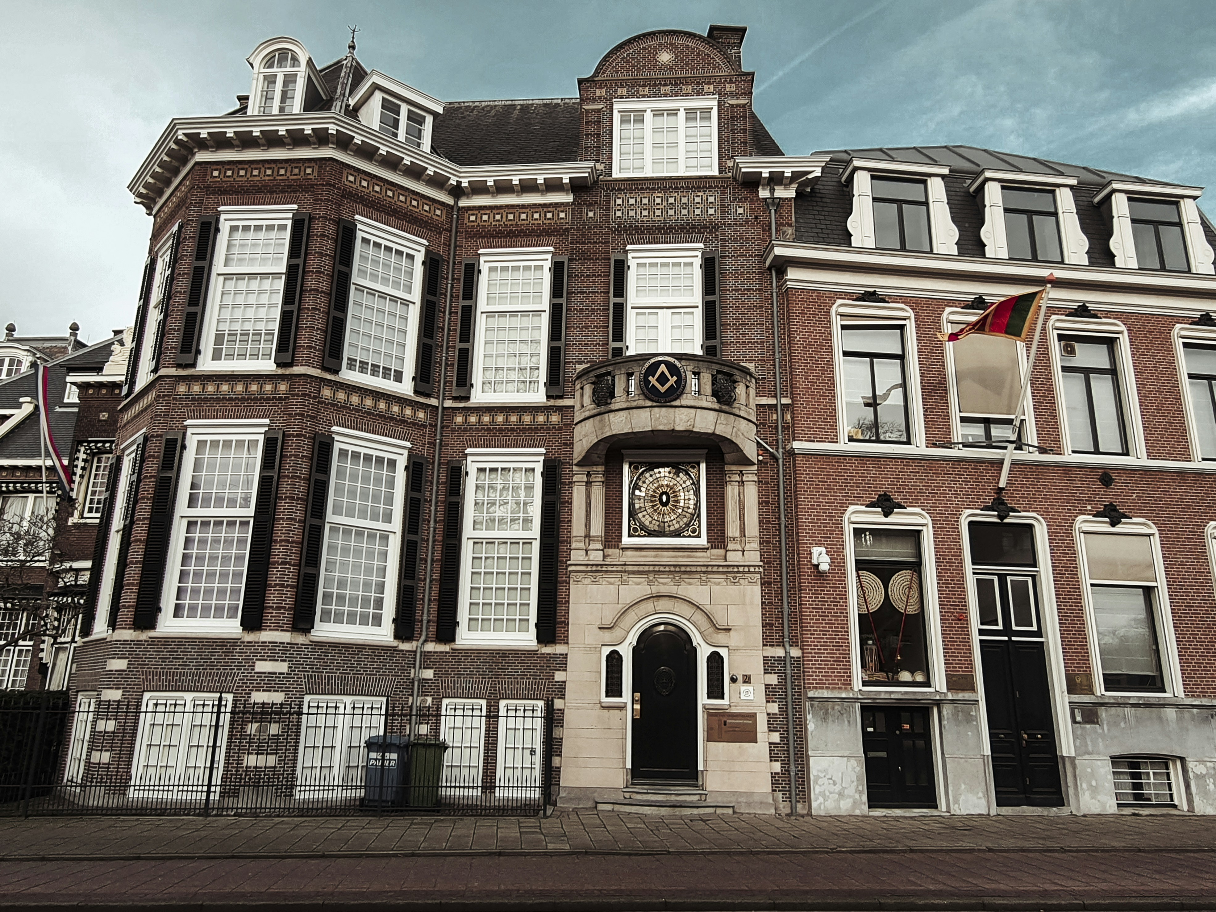 a large brick building with a clock on the front of it
