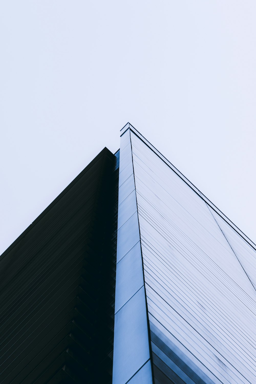 a tall building with a sky in the background