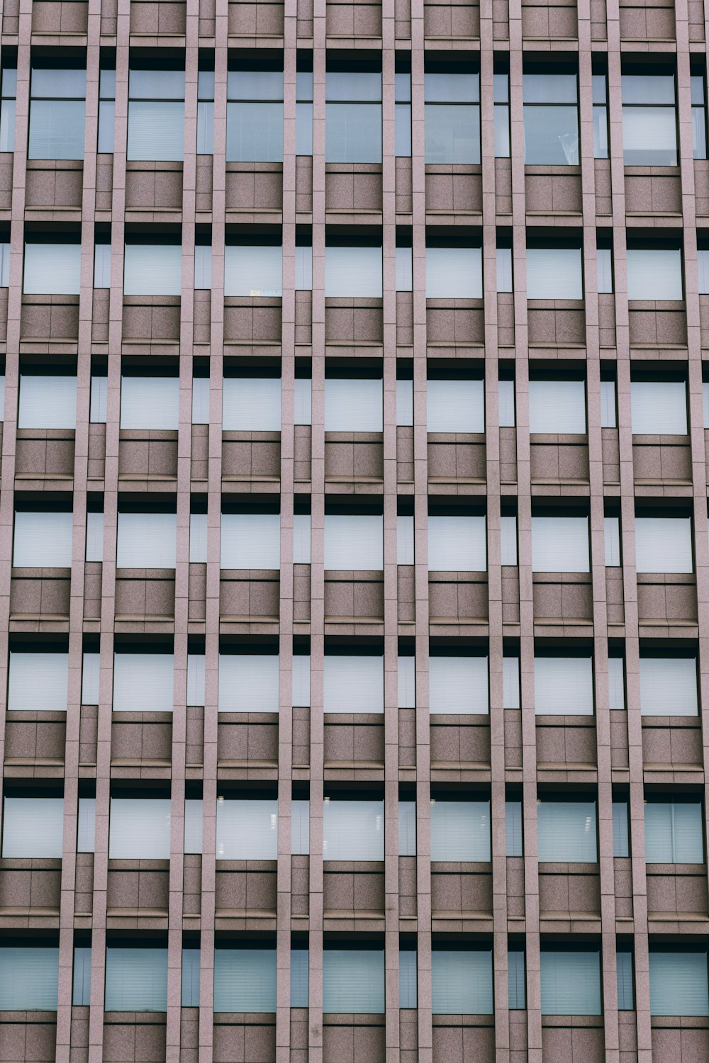 a tall building with lots of windows next to it