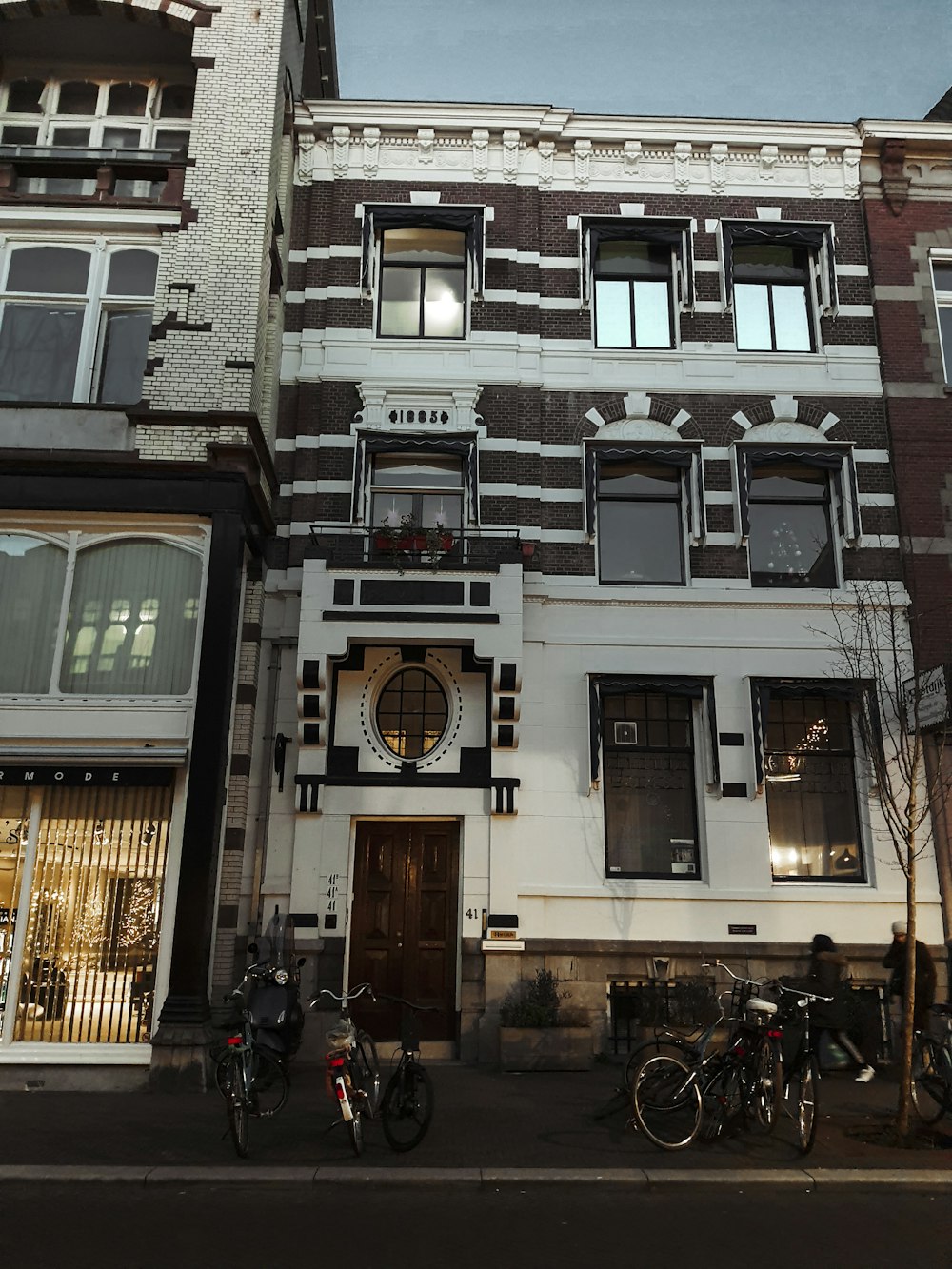 two bicycles parked in front of a building