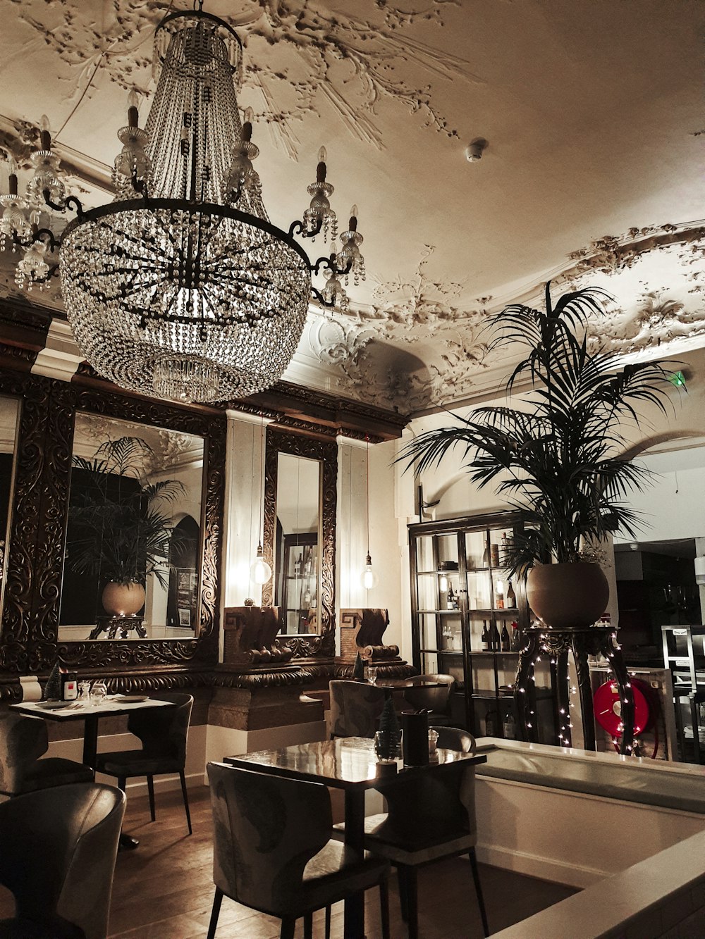 a chandelier hanging from the ceiling of a restaurant