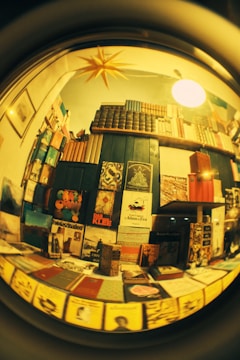 a view of a bookshelf through a magnifying glass