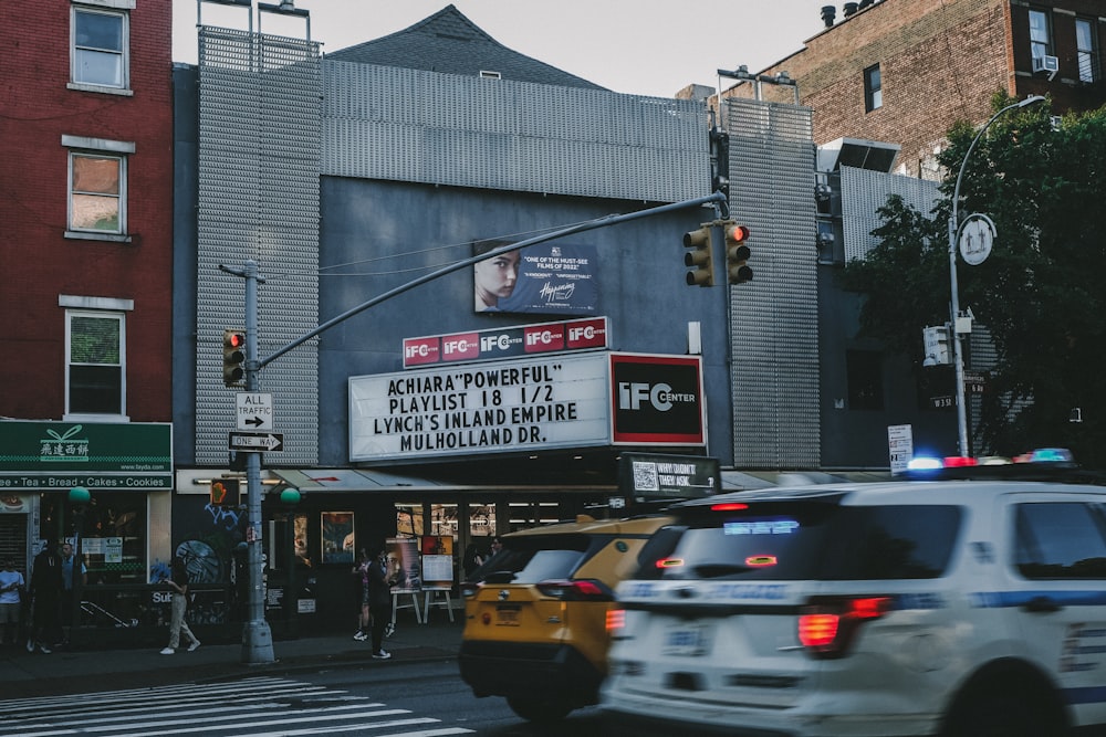 a movie marquee on the corner of a city street