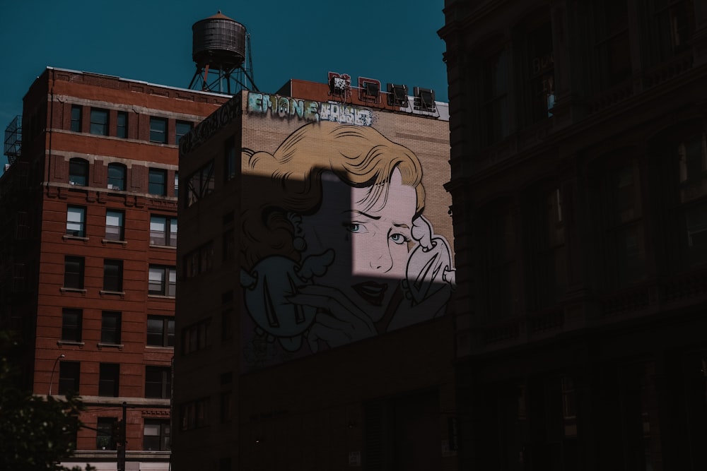 a picture of a woman on the side of a building