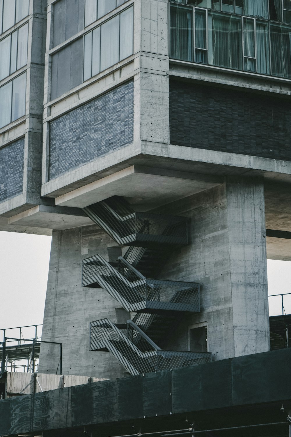 a very tall building with a bunch of stairs going up it