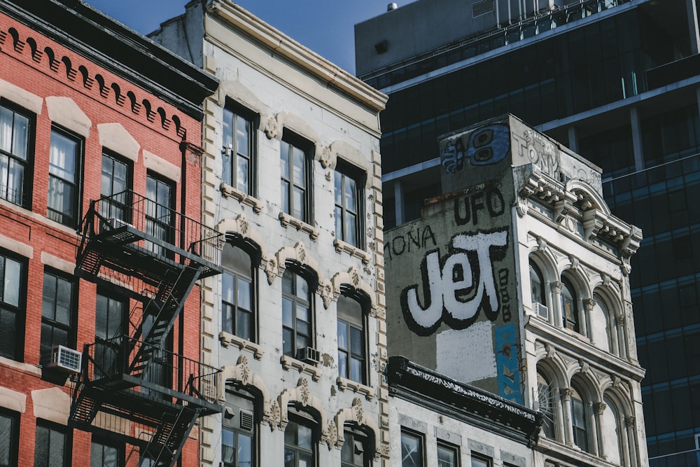 a sign on the side of a building in a city