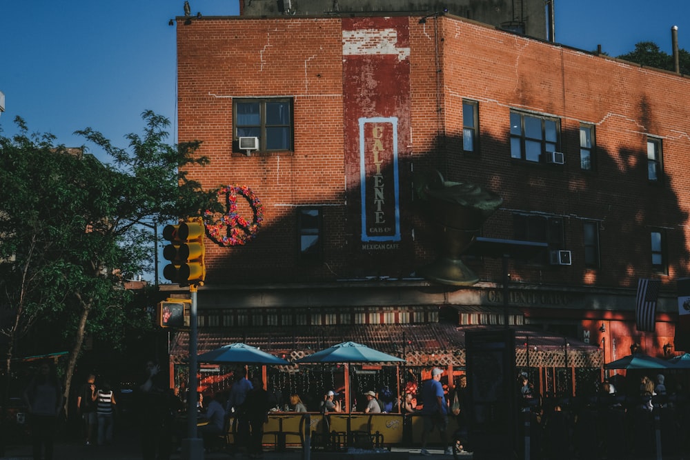 a group of people standing outside of a building