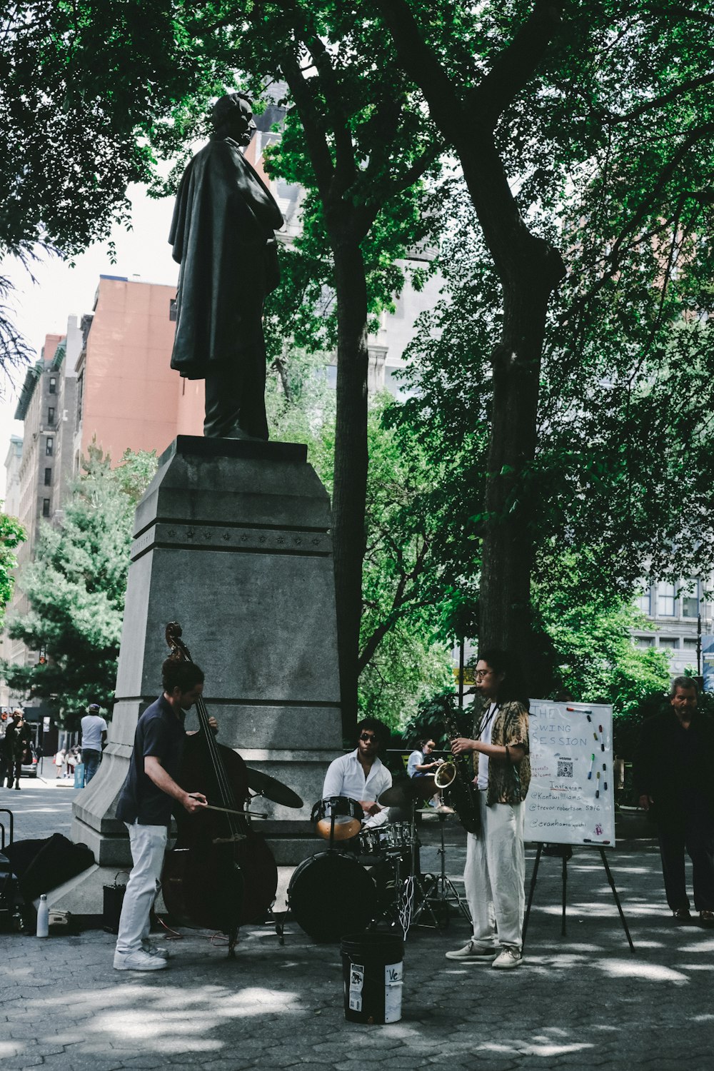 a group of people standing around a statue