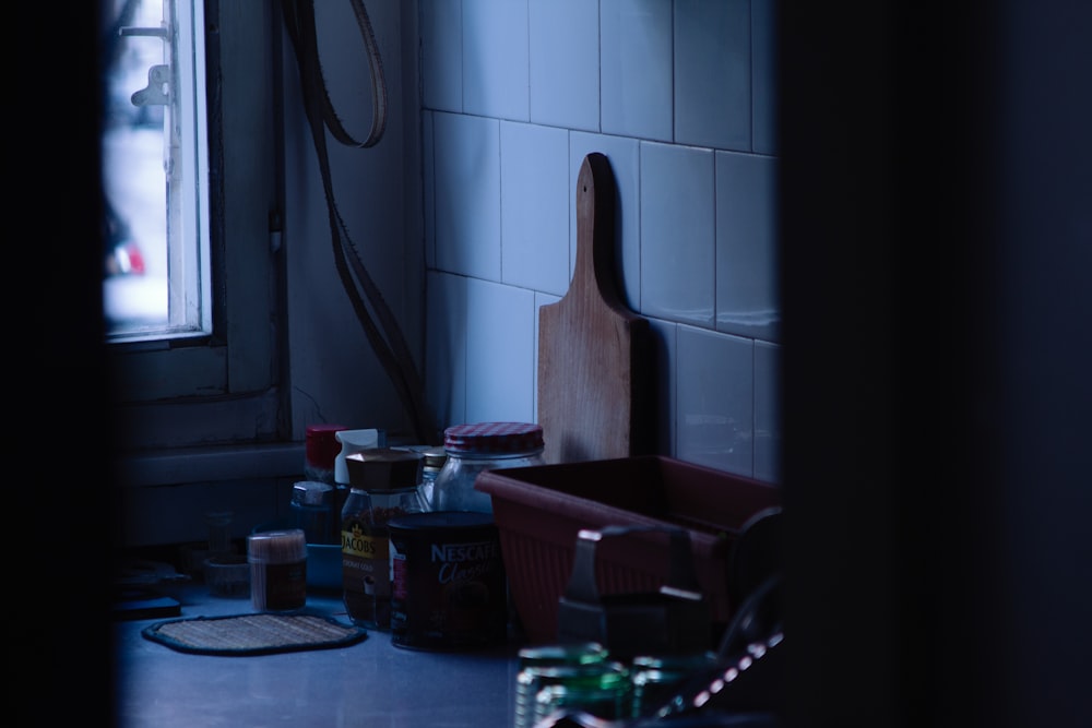 a kitchen counter with a cutting board and other kitchen items