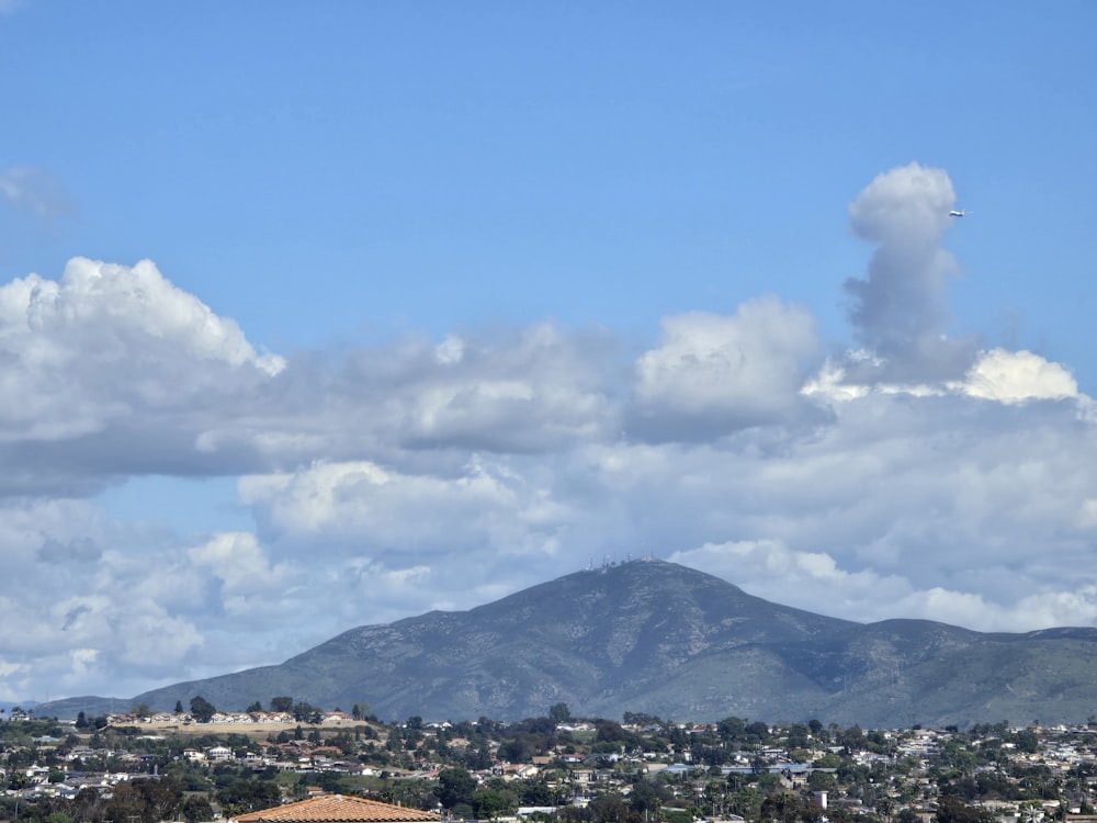 a view of a city with a mountain in the background