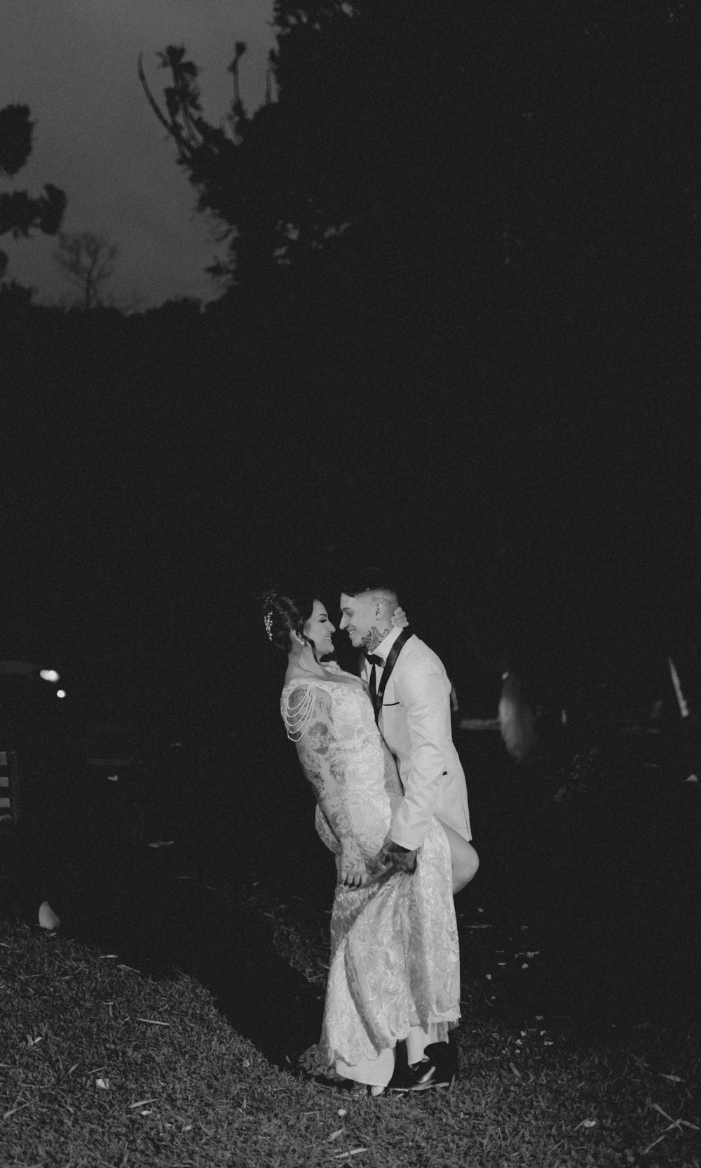 a man and a woman kissing in the dark