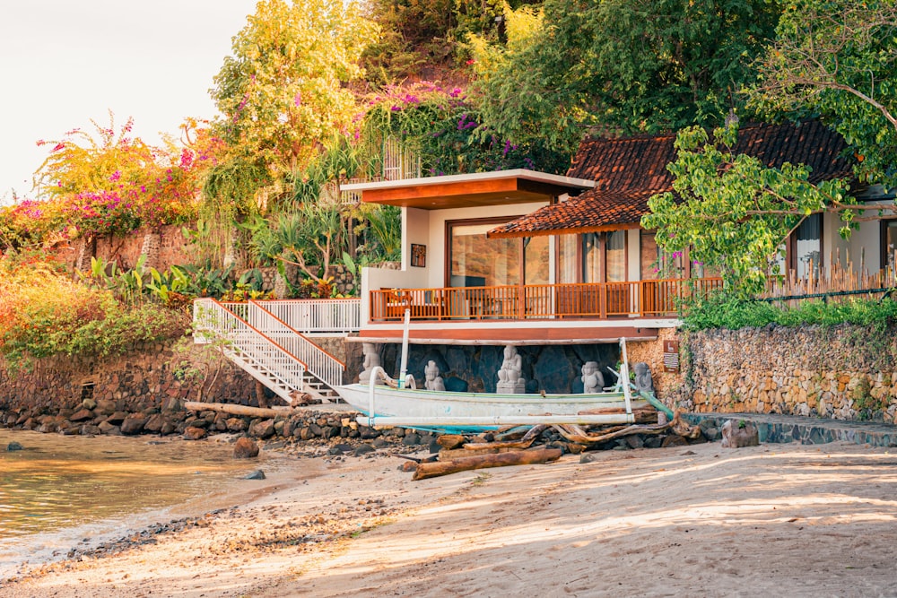 a house on the shore of a beach