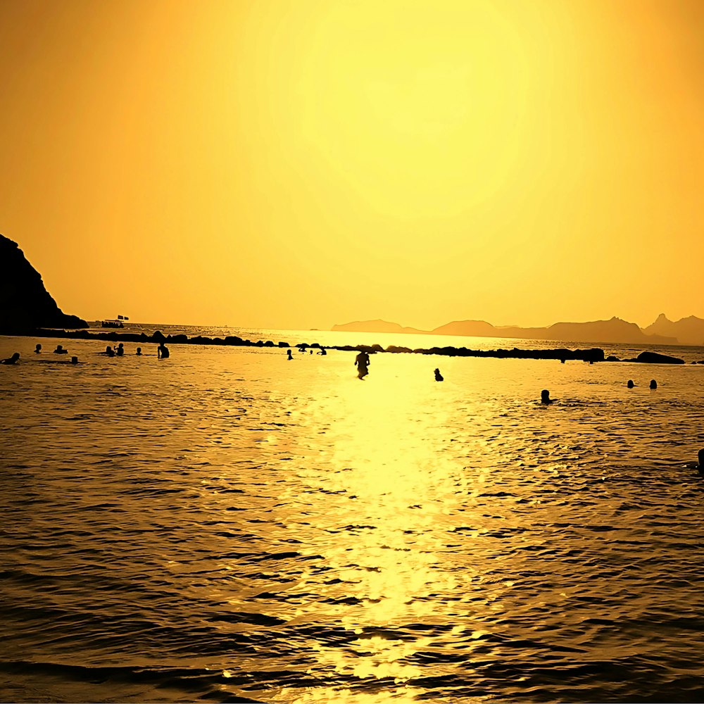 a large body of water with a boat in the distance