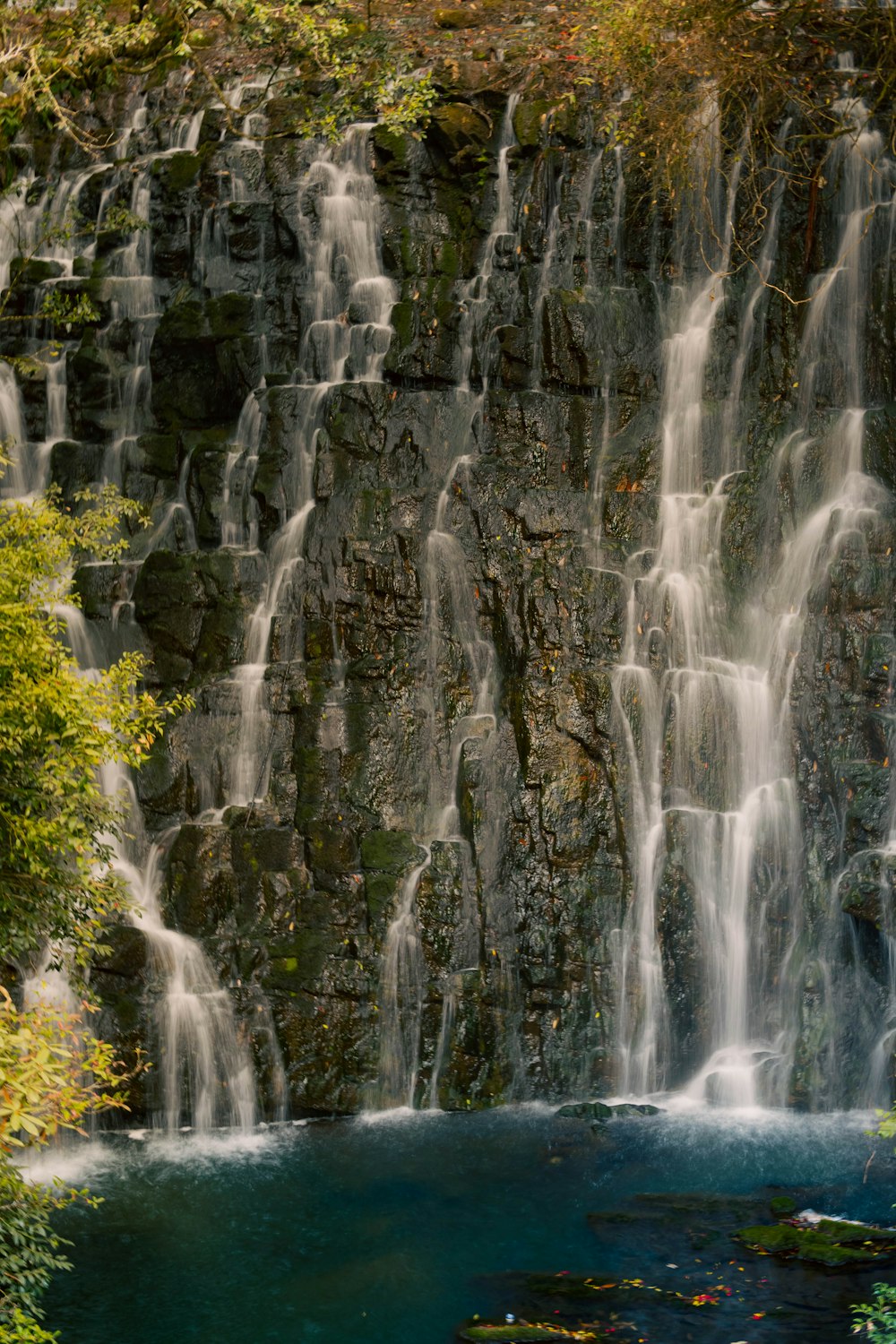 a large waterfall with lots of water running down it