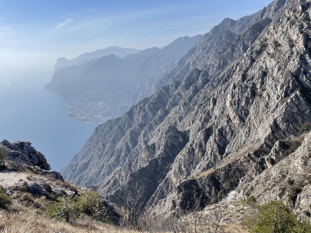 a view of a mountain range with a body of water in the distance