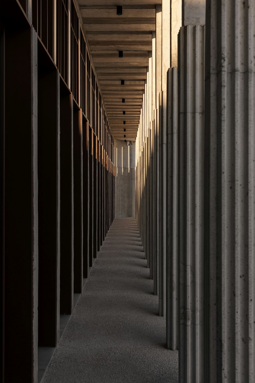 a row of storage units lined up against a wall