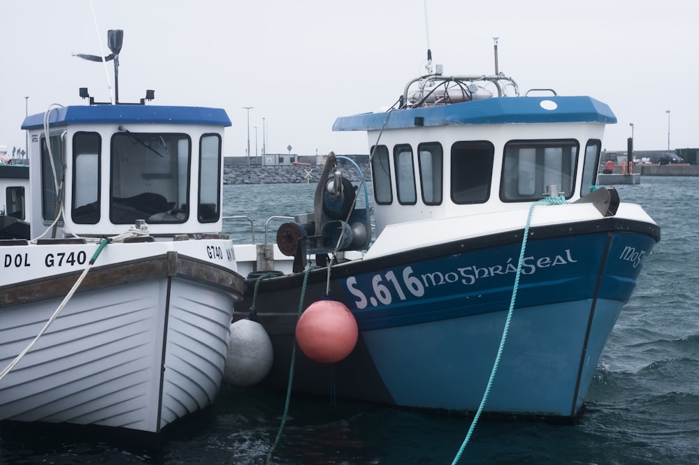 a couple of boats that are sitting in the water